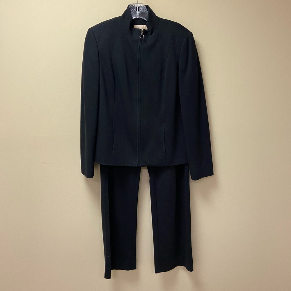 Black pantsuit, zipper jacket, pull on pants, straight leg.